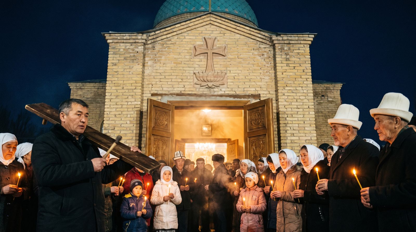 Candles and the wooden nakus at the doors of the Church of St. Janyl in Holy Week